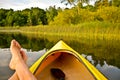 Feet in boat on lake Royalty Free Stock Photo
