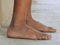 The feet of both boys playing dirty on the floor without shoes Royalty Free Stock Photo