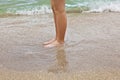 Feet of boy running along the beach Royalty Free Stock Photo