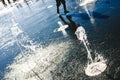 Feet of boy running playing with a water fountain in a park in summer Royalty Free Stock Photo