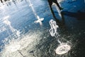 Feet of boy running playing with a water fountain in a park in summer Royalty Free Stock Photo