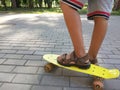 Feet of a boy on a skateboard. Royalty Free Stock Photo