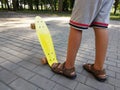 Feet of a boy on a skateboard. Royalty Free Stock Photo