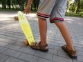 Feet of a boy on a skateboard. Royalty Free Stock Photo