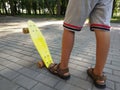 Feet of a boy on a skateboard. Royalty Free Stock Photo