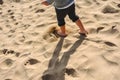 Feet of boy walking on the sand of the beach Royalty Free Stock Photo