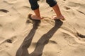 Feet of boy walking on the sand of the beach Royalty Free Stock Photo