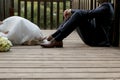 feet of bride and groom, wedding shoes (soft focus). Cross processed image for vintage look Royalty Free Stock Photo