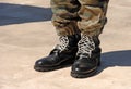 Feet of camouflaged soldier Royalty Free Stock Photo