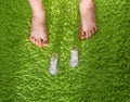 The feet of the child have grown large, and the shoes are very small. Concept of new shoes for children. Children`s feet grow ver Royalty Free Stock Photo