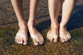 Feet in the clear water