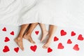 Feet close up of young loving couple enjoying on the bed Royalty Free Stock Photo