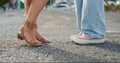 Feet, closeup and women in a road, shy and flirting while on their first date in a city. Shoes, lgbtq and lesbian couple Royalty Free Stock Photo