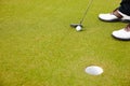 Feet, club and golf ball for hole on field, training and practice for competition or tournament. Closeup, shoes and Royalty Free Stock Photo