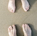 Feet of a couple at the beach Royalty Free Stock Photo