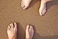 Feet of a couple at the beach Royalty Free Stock Photo