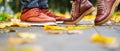 Feet of a couple in love in brown shoes