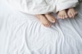 Feet of a couple sleeping side by side. Royalty Free Stock Photo