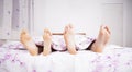 Feet of a couple sleeping side by side Royalty Free Stock Photo