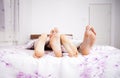 Feet of a couple sleeping side by side Royalty Free Stock Photo