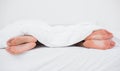 Feet of a couple on their opposite sides in bed Royalty Free Stock Photo