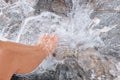 Feet in crystal clear stream water