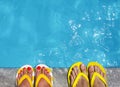 Feet in flip flops on stone background Royalty Free Stock Photo