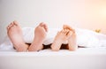 The feet or foot of couples sleeping on the bed Royalty Free Stock Photo