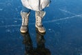 feet on frozen ice, frozen river, thick ice Royalty Free Stock Photo