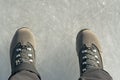 Feet on frozen ice, frozen river, thick ice, man standing Royalty Free Stock Photo