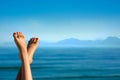 Feet of girl on the background of mountains. Royalty Free Stock Photo