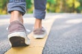 Feet of girl walking in the road Royalty Free Stock Photo