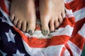Feet girls stand on the flag of the United States. green board Royalty Free Stock Photo