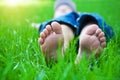 Feet on grass. Family picnic in spring park Royalty Free Stock Photo