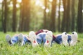 Feet of a group of young people while lying down on a green grass Royalty Free Stock Photo