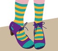 Feet with high heels and striped socks