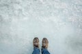 Feet on ice background, walking on Athabasca glacier in Columbia Icefield, Jasper National park, Rocky Mountains, Alberta Canada