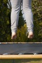 Closeup of feet low above the trampoline Royalty Free Stock Photo