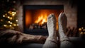 Feet in knitted socks against the background of a fireplace home