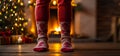 Feet in knitted socks against the background of a fireplace home fireside comfort