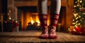 Feet in knitted socks against the background of a fireplace home fireside