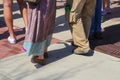 Feet and legs of protesters in shorts, long pants and a hippy skirt at March for life protest