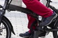 Feet of man pedaling on electric bicycle Royalty Free Stock Photo