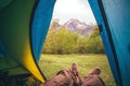 Feet Man relaxing from tent camping entrance outdoor Royalty Free Stock Photo