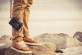 Feet man and vintage retro photo camera Royalty Free Stock Photo