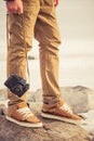 Feet man and vintage retro photo camera outdoor Royalty Free Stock Photo