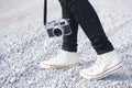 Feet man and vintage retro photo camera outdoor Travel Lifestyle Royalty Free Stock Photo