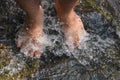 Feet Man in waterfall ,Lifestyle Travel concept waterfall in the forest