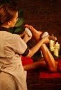 Feet massage with Thai reflexology. Cropped shot of foot reflexology.