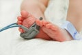 Feet of new born baby sick in incubator chamber Royalty Free Stock Photo